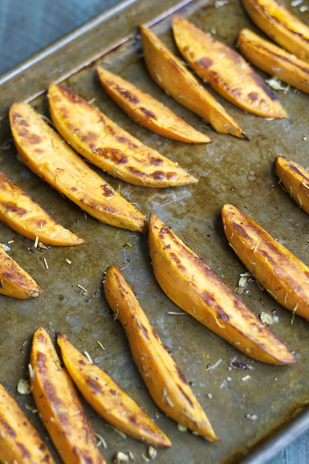 roasted sweet potato wedges on a baking tray
