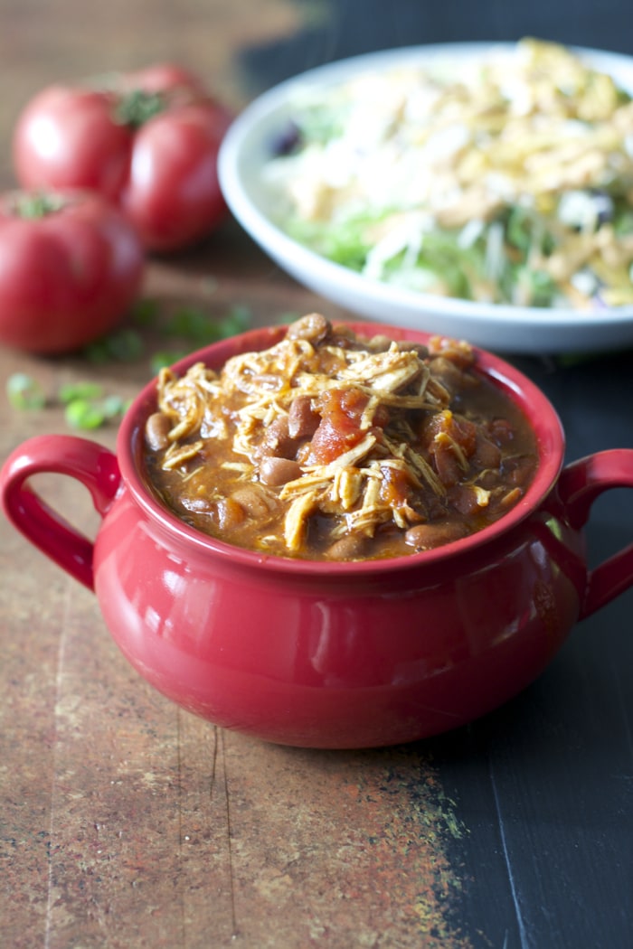 crockpot salsa chicken in a red bowl 