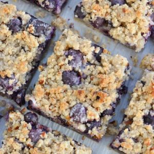 Try these deliciously sweet Keto Blueberry Bars loaded with almond flour, pecans, vanilla and tons of berries! At just 3 net carbs per slice this is the perfect low carb dessert!