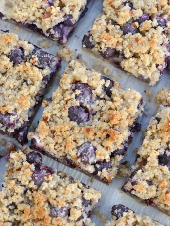 Try these deliciously sweet Keto Blueberry Bars loaded with almond flour, pecans, vanilla and tons of berries! At just 3 net carbs per slice this is the perfect low carb dessert!