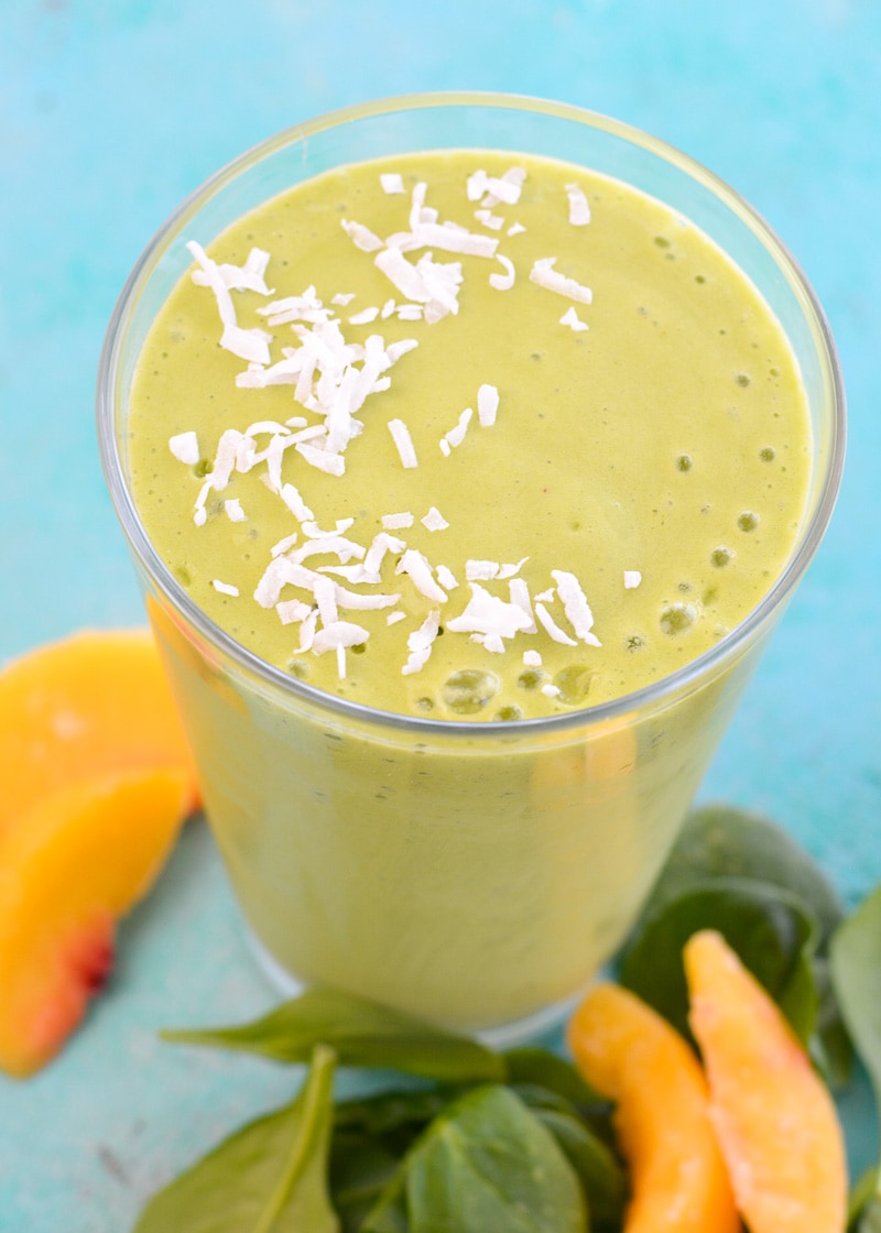 Overhead view of a peach and mango smoothie in a glass. 