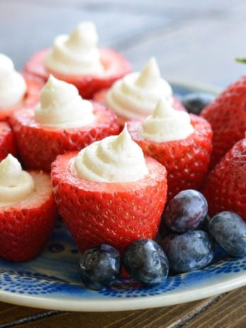 These Cheesecake Stuffed Strawberries look fancy, but they're a breeze to make! Perfect for picnics and potlucks! 