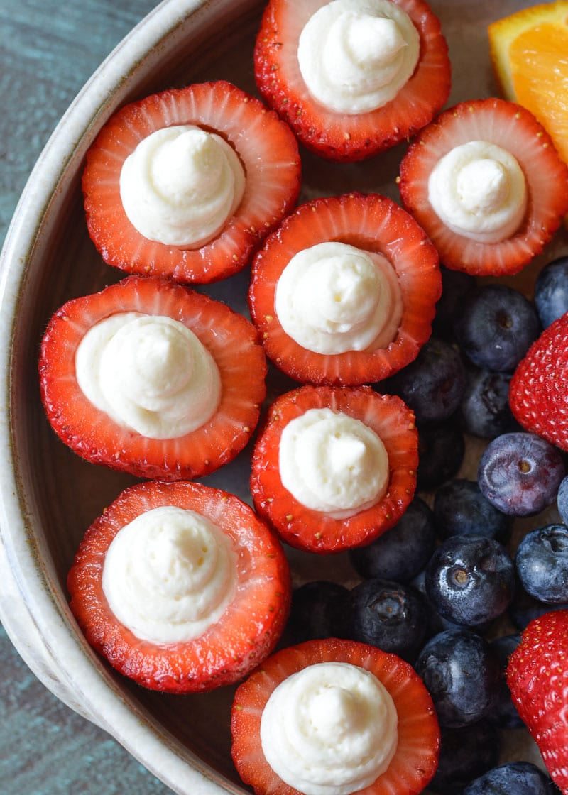 These Cheesecake Stuffed Strawberries look fancy, but they're a breeze to make! Perfect for picnics and potlucks! 