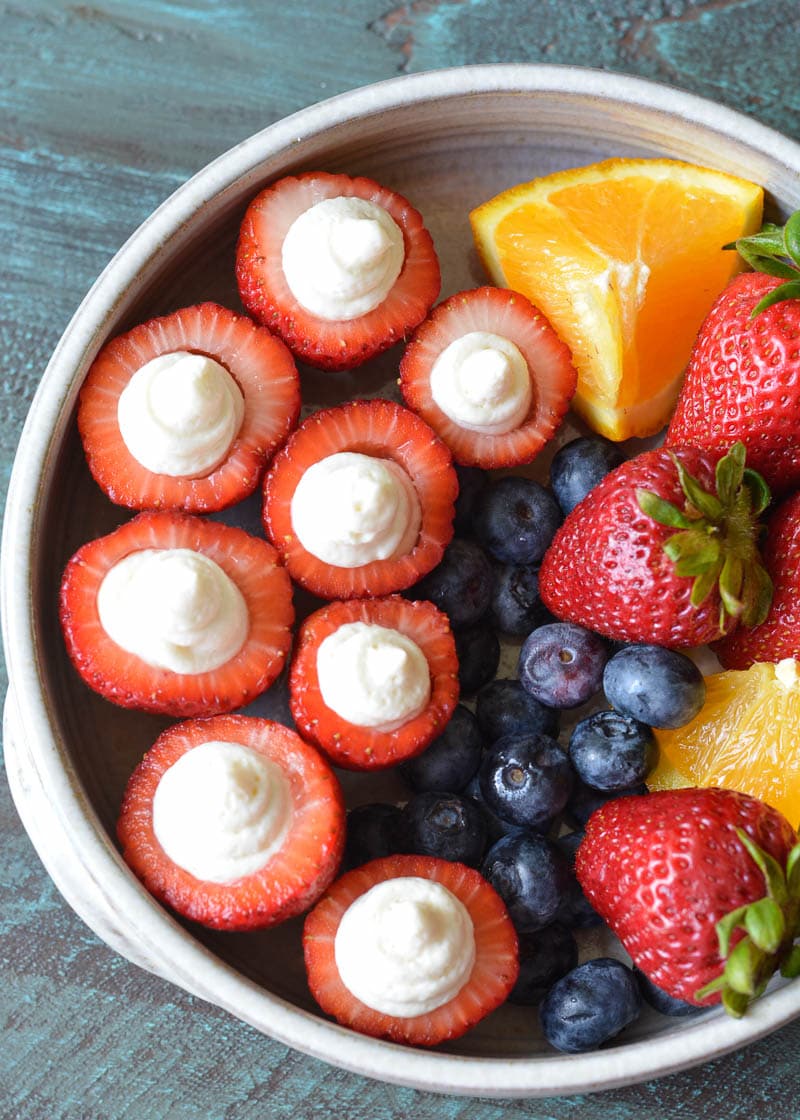 These Cheesecake Stuffed Strawberries look fancy, but they're a breeze to make! Perfect for picnics and potlucks! 