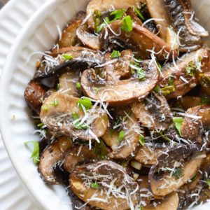 These Italian Baked Mushrooms are smothered in a delicious butter, garlic and herb sauce! This is the perfect easy, low carb side dish recipe!