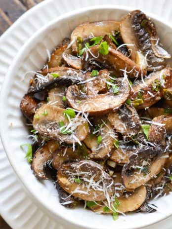 These Italian Baked Mushrooms are smothered in a delicious butter, garlic and herb sauce! This is the perfect easy, low carb side dish recipe!