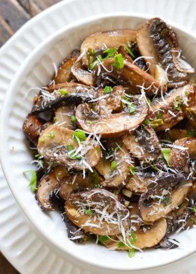 These Italian Baked Mushrooms are smothered in a delicious butter, garlic and herb sauce! This is the perfect easy, low carb side dish recipe!