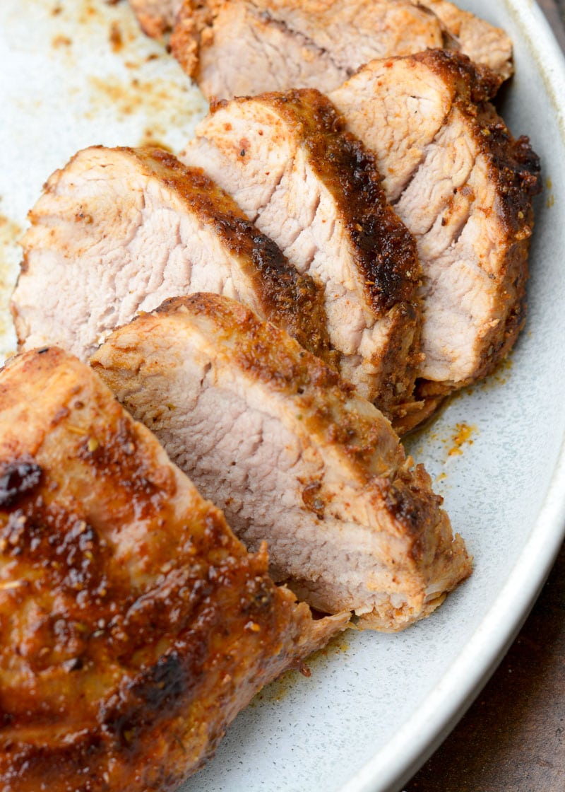 This easy Smoked Pork Tenderloin is flavored with the most amazing homemade dry rub, then slow cooker to perfection on the grill!