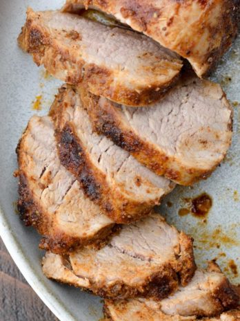 This easy Smoked Pork Tenderloin is flavored with the most amazing homemade dry rub, then slow cooker to perfection on the grill!