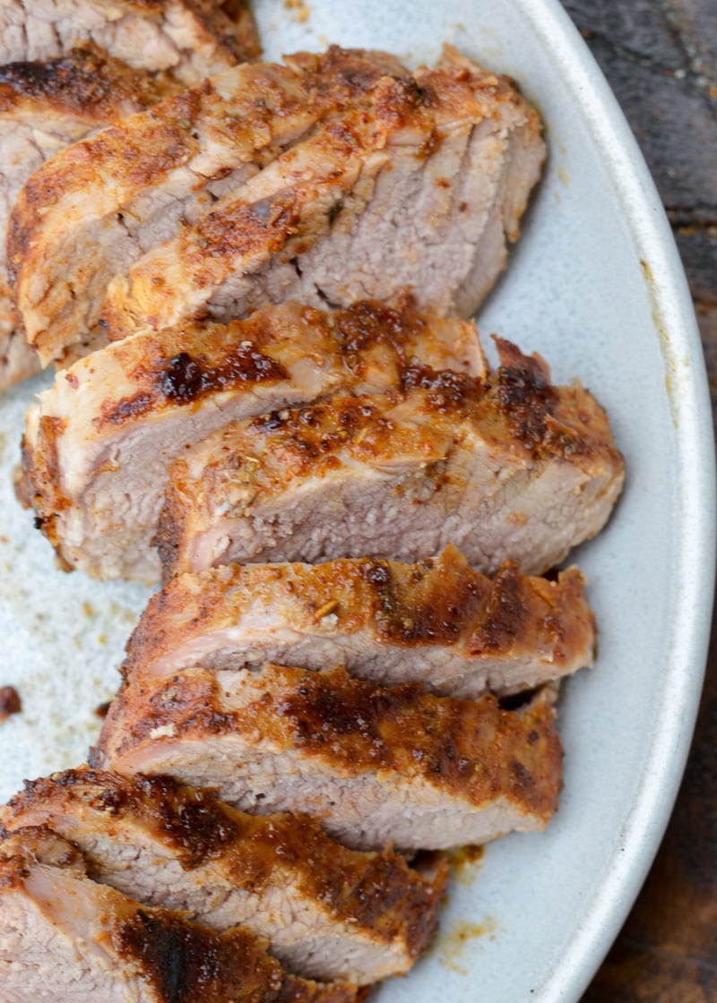 This easy Smoked Pork Tenderloin is flavored with the most amazing homemade dry rub, then slow cooker to perfection on the grill!