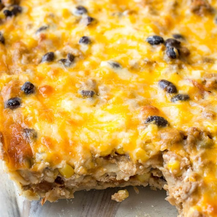 Need an easy recipe to feed a crowd? This Taco Lasagna is loaded with taco meat, black beans, corn and cheese and perfect for busy nights!