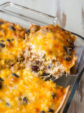 Need an easy recipe to feed a crowd? This Taco Lasagna is loaded with taco meat, black beans, corn, and cheese. Perfect for busy nights!