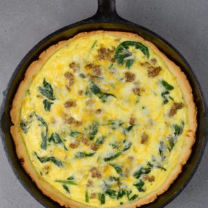 This Sausage and Spinach Quiche is the perfect easy brunch recipe that is deceptively impressive! With options for low carb, keto and gluten free diets this recipe is perfect for everyone!