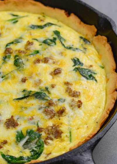This Sausage and Spinach Quiche is the perfect easy brunch recipe that is deceptively impressive! With options for low carb, keto and gluten free diets this recipe is perfect for everyone!