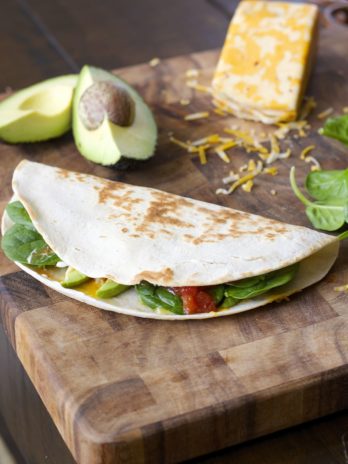 This Spicy Spinach and Avocado Quesadilla is a simple six ingredient meal! A healthy, hearty dinner perfect for busy nights!