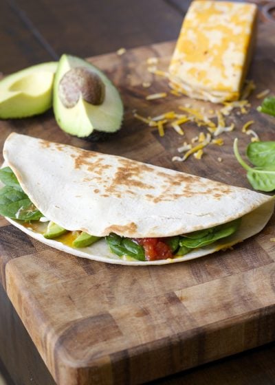 This Spicy Spinach and Avocado Quesadilla is a simple six ingredient meal! A healthy, hearty dinner perfect for busy nights!