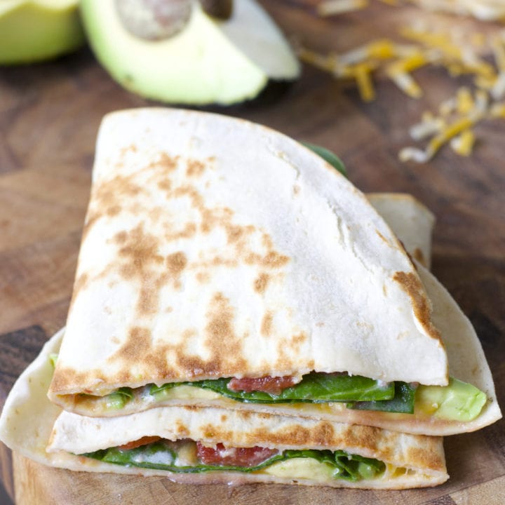 This Spicy Spinach and Avocado Quesadilla is a simple six ingredient meal! A healthy, hearty dinner perfect for busy nights!