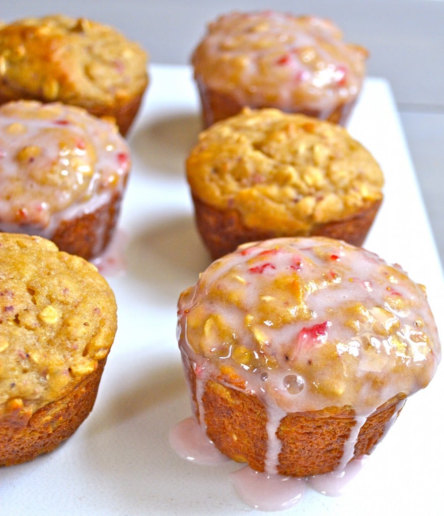 six healthy strawberry muffins on a white plate 