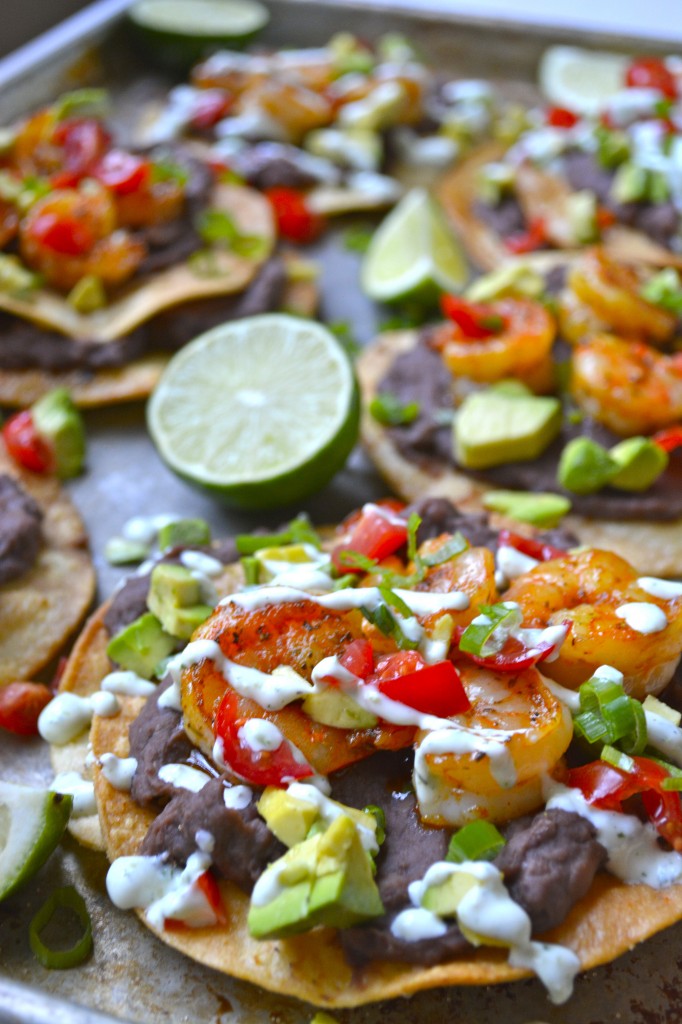 Closeup of a shrimp tostada on a homemade tostada shell. 