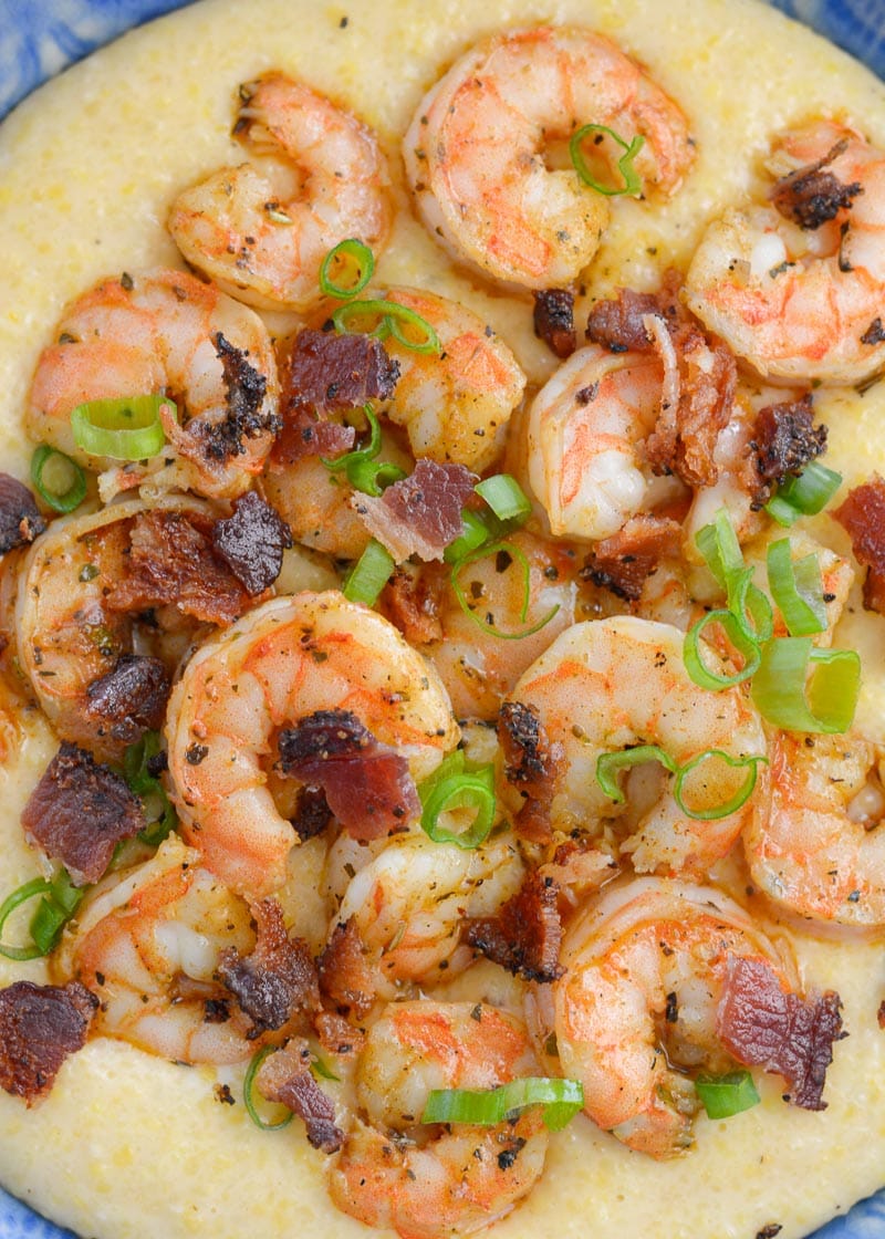 Cheesy Shrimp and Grits are the ultimate southern meal! Cheesy grits, spicy shrimp, crispy bacon and fresh green onions are perfect comfort food!