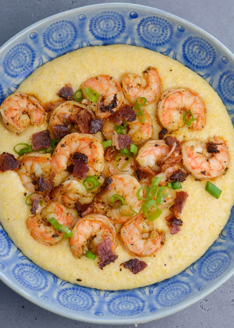 Cheesy Shrimp and Grits are the ultimate southern meal! Cheesy grits, spicy shrimp, crispy bacon and fresh green onions are perfect comfort food!