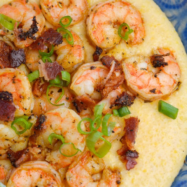 Cheesy Shrimp and Grits are the ultimate southern meal! Cheesy grits, spicy shrimp, crispy bacon and fresh green onions are perfect comfort food!