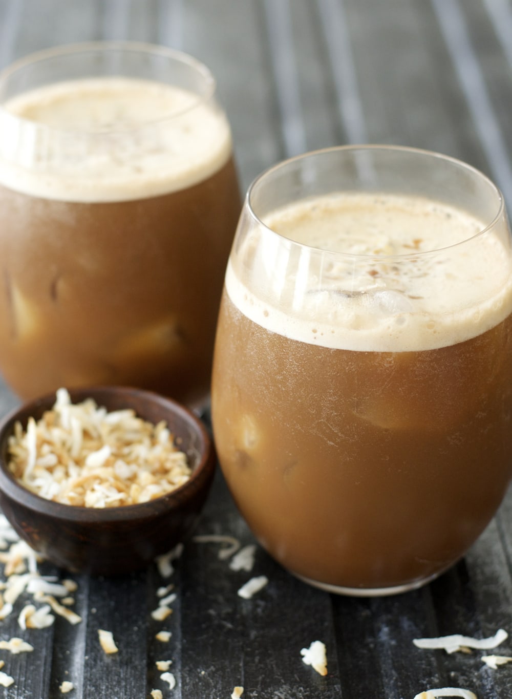 This easy Blended Coconut Mocha Frappuccino combines creamy almond milk with chocolate, coconut, and rich coffee for the perfect summer pick me up!