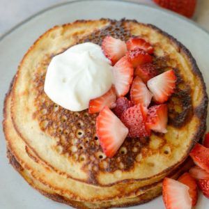 These Strawberry Pancakes are topped with a sweet vanilla cream cheese glaze! These low carb almond flour pancakes are the perfect keto breakfast! 