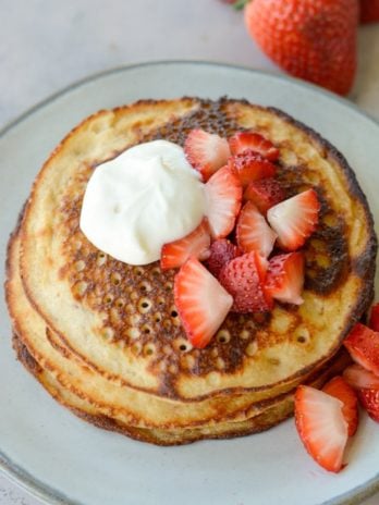 These Strawberry Pancakes are topped with a sweet vanilla cream cheese glaze! These low carb almond flour pancakes are the perfect keto breakfast! 