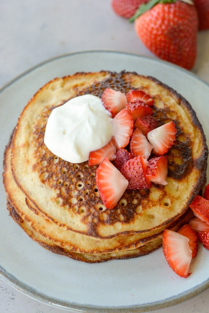 These Strawberry Pancakes are topped with a sweet vanilla cream cheese glaze! These low carb almond flour pancakes are the perfect keto breakfast! 