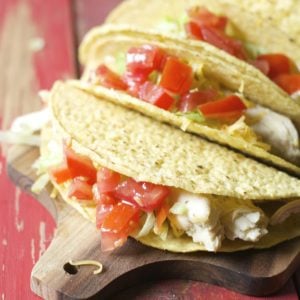 These Slow Cooker Zesty Chicken Tacos are slow simmered in a mixture of spices of salsa verde! An easy, healthy dinner your entire family will love!