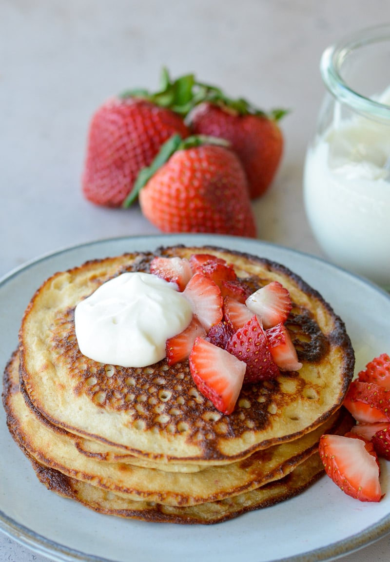 These Strawberry Pancakes are topped with a sweet vanilla cream cheese glaze! These low carb almond flour pancakes are the perfect keto breakfast! 