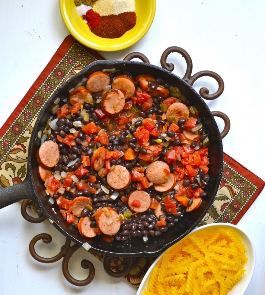 This easy One Pan Pasta is a quick, 30-minute meal that is packed with Spicy Sausage and Black Beans! The perfect one-dish family dinner!