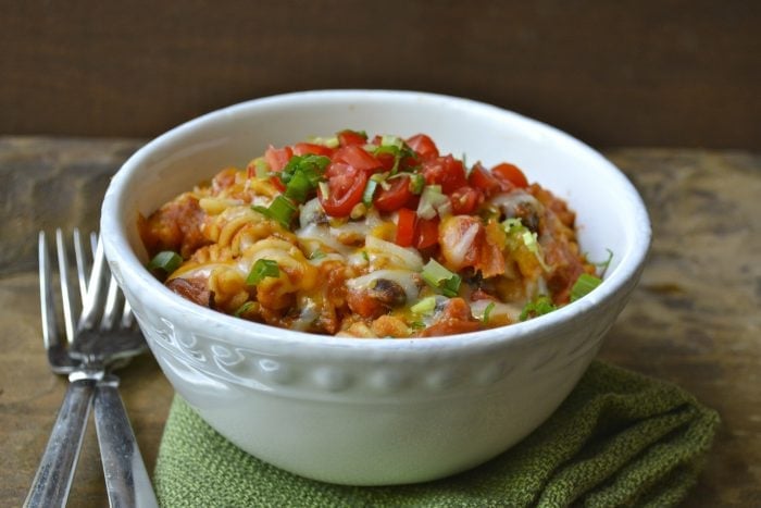 This easy One Pan Pasta is a quick, 30-minute meal that is packed with Spicy Sausage and Black Beans! The perfect one-dish family dinner!