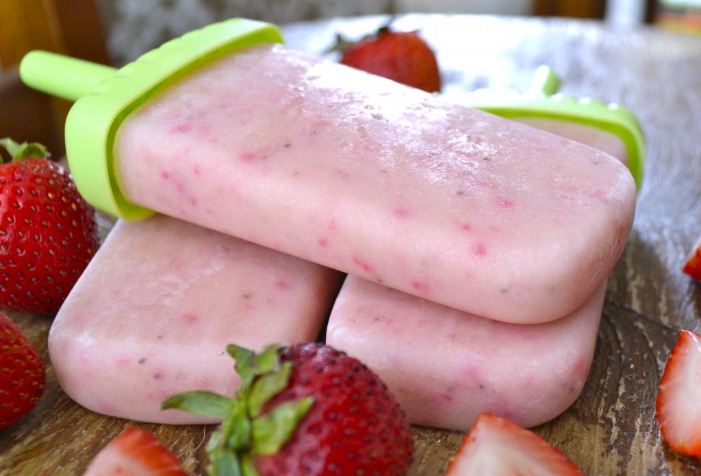 A stack of three pudding pops made with strawberries and instant vanilla pudding. 