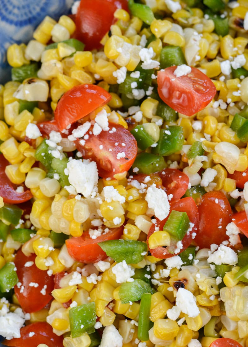 Make this Corn and Tomato Salad recipe for your next potluck or BBQ. It's a quick and easy summer side dish that everyone loves!