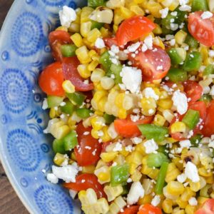 Make this Corn and Tomato Salad recipe for your next potluck or BBQ. It's a quick and easy summer side dish that everyone loves!