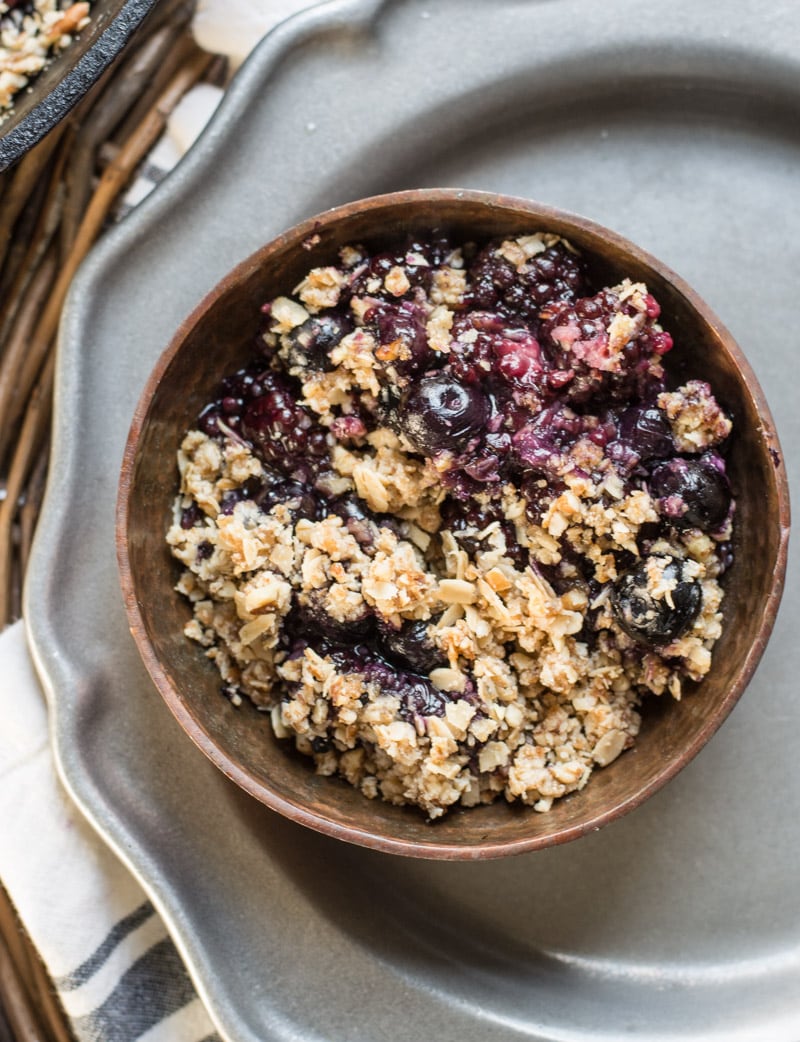 Overhead view of mixed berry crisp in a small bowl 