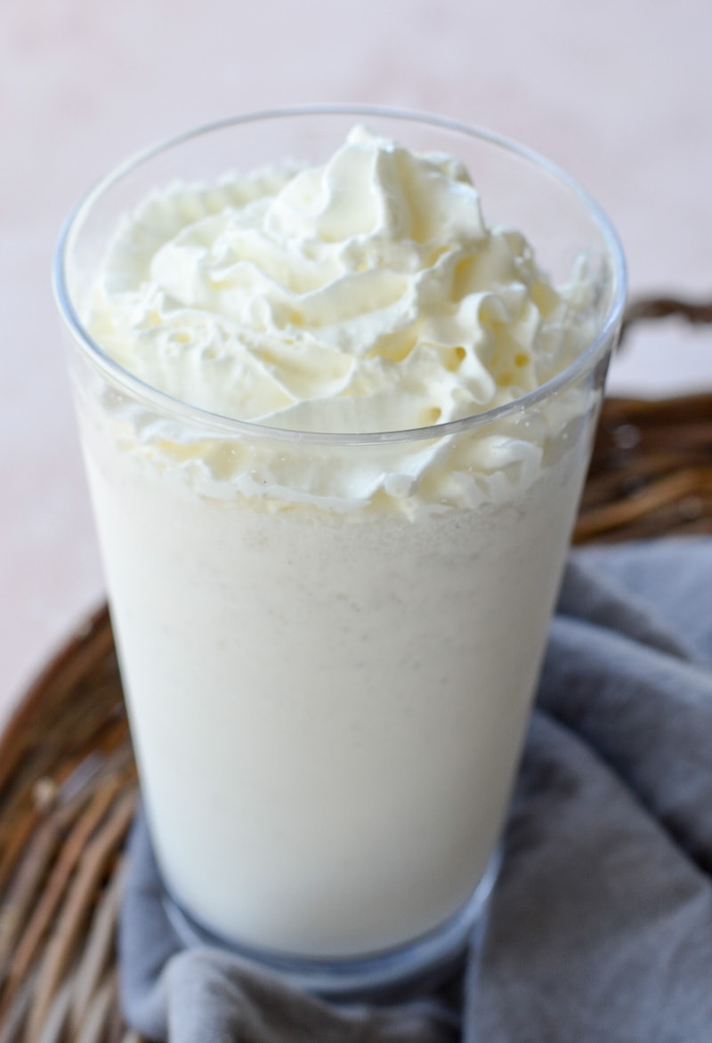 A copycat Starbucks vanilla frappuccino in a tall glass. 