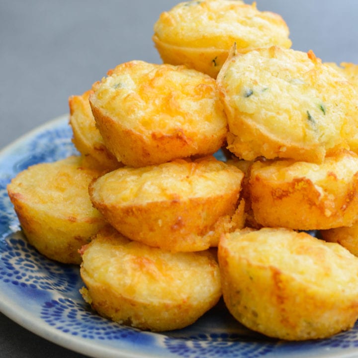 These fluffy, moist Cheddar Corn Muffins have an amazing, healthy, super secret ingredient! It's the perfect dinner side to help sneak more vegetables into your diet with no complaints!