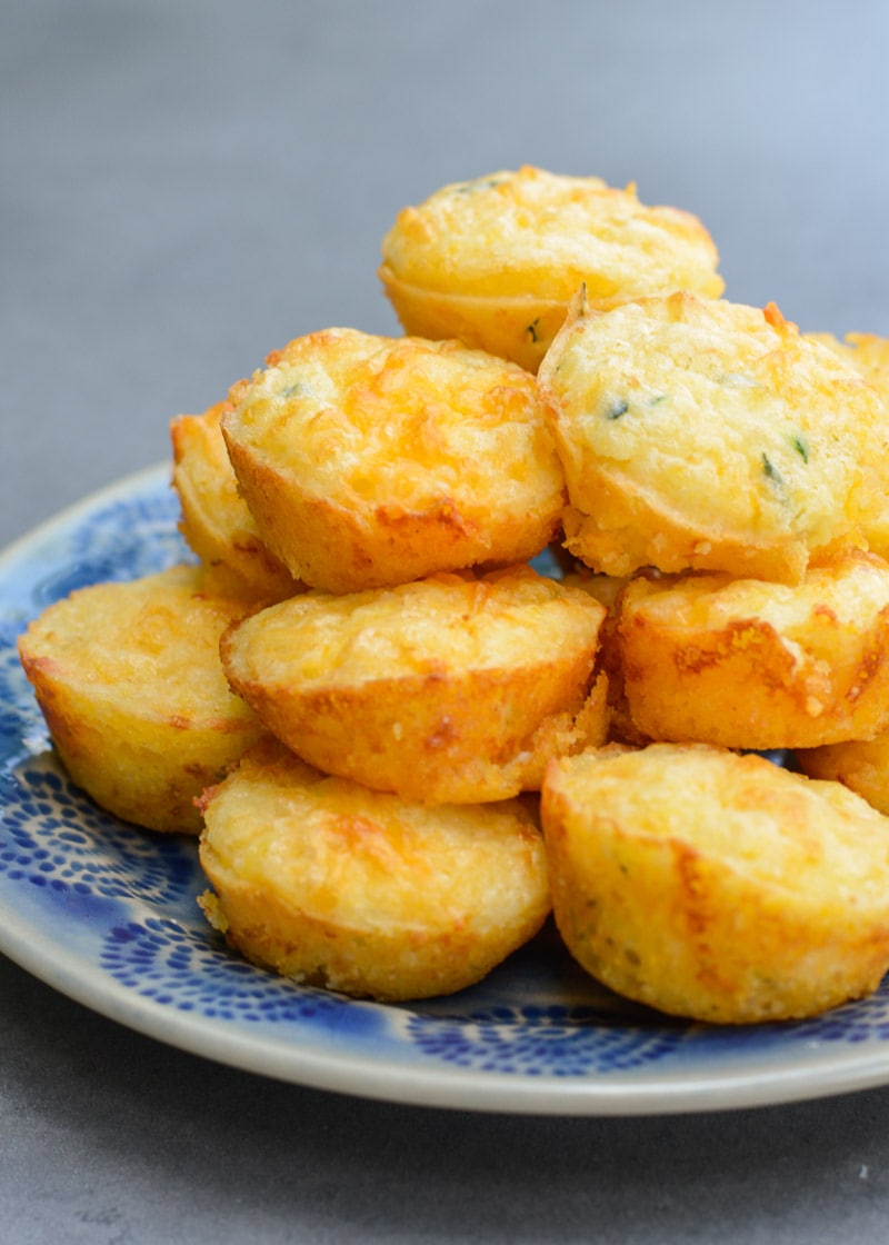 These fluffy, moist Cheddar Corn Muffins have an amazing, healthy, super secret ingredient! It's the perfect dinner side to help sneak more vegetables into your diet with no complaints!