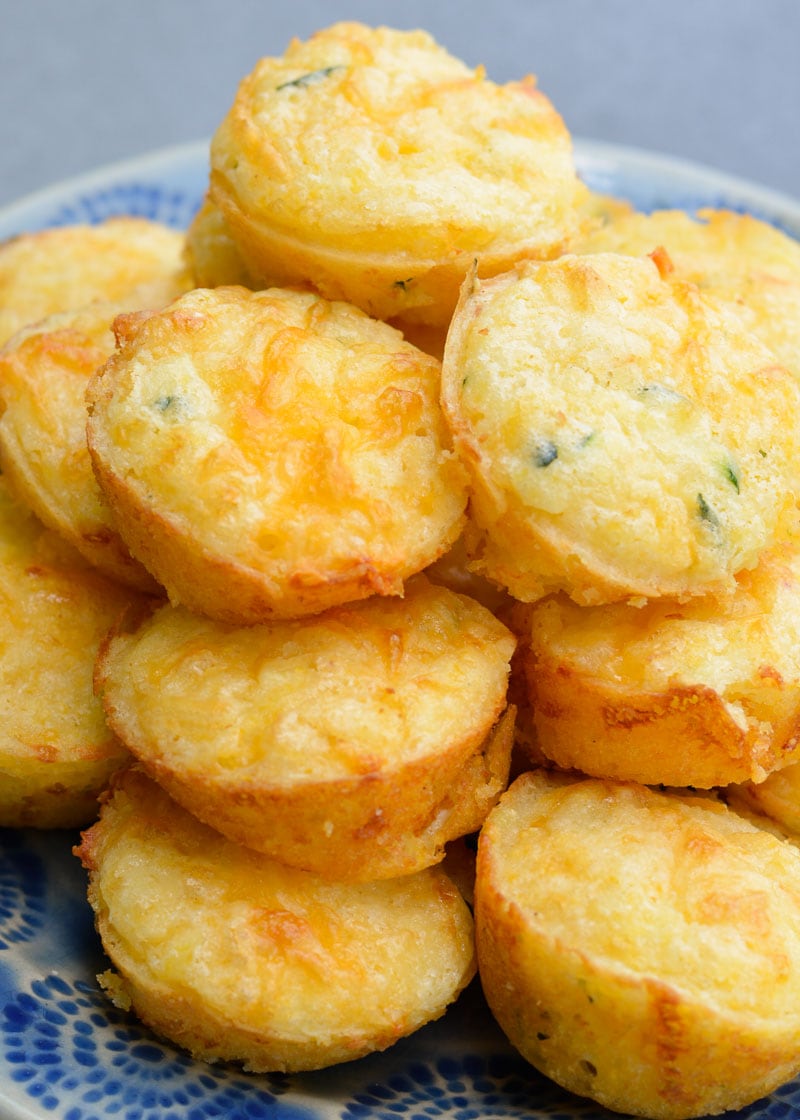 These fluffy, moist Cheddar Corn Muffins have an amazing, healthy, super secret ingredient! It's the perfect dinner side to help sneak more vegetables into your diet with no complaints!