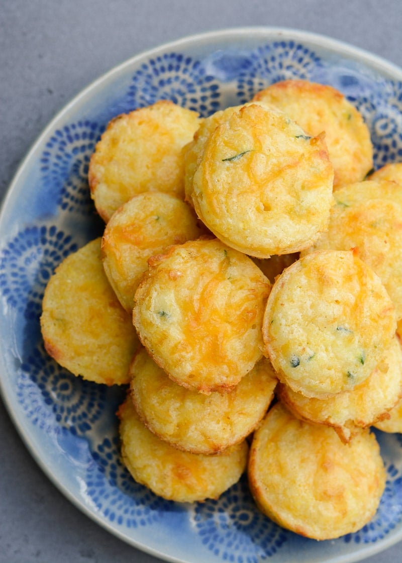 These fluffy, moist Cheddar Corn Muffins have an amazing, healthy, super secret ingredient! It's the perfect dinner side to help sneak more vegetables into your diet with no complaints!