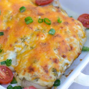 Try my favorite Cheesy Chicken Bake for an easy one pan, keto-friendly dinner recipe! Each serving of chicken is smothered with green chiles, cheese and ranch for less than 4 net carbs! 