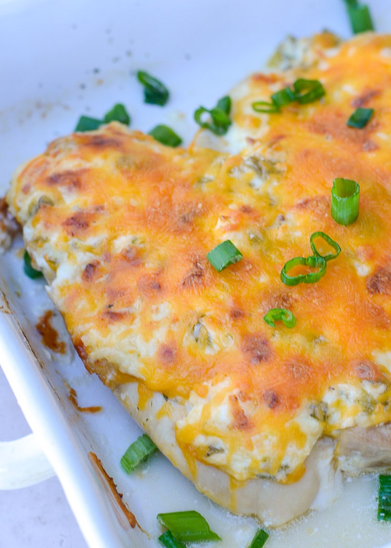 Try my favorite Cheesy Chicken Bake for an easy one pan, keto-friendly dinner recipe! Each serving of chicken is smothered with green chiles, cheese and ranch for less than 4 net carbs! 