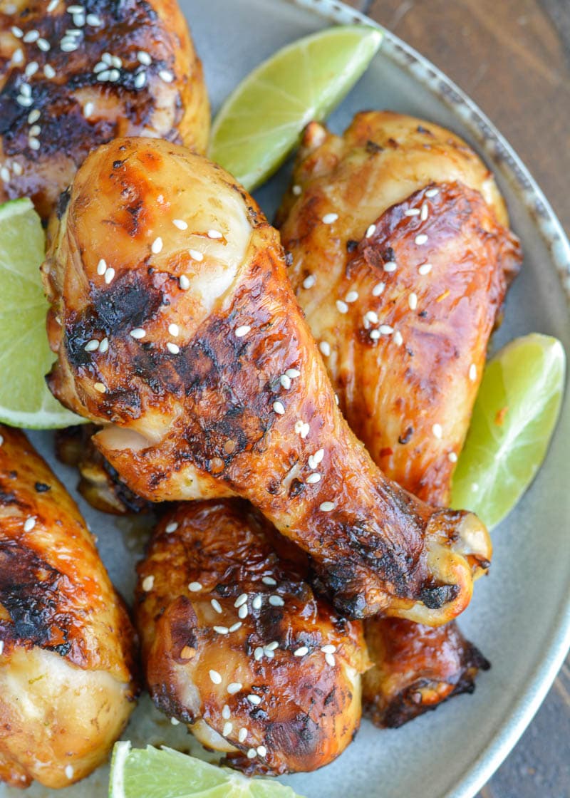 Grilled Chicken Legs are the perfect easy dinner recipe! This chicken is marinaded in an Asian sauce that pairs perfectly with grilled vegetables!