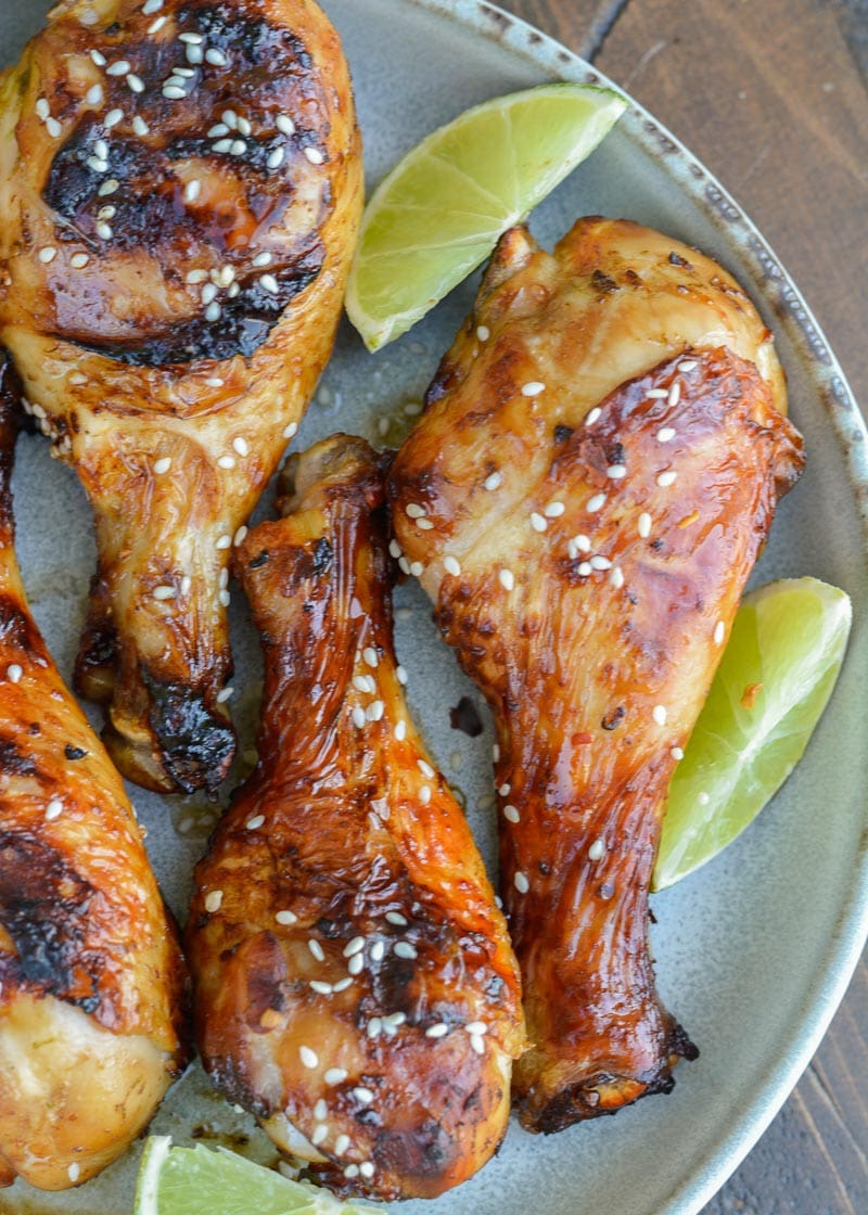 Grilled Chicken Legs are the perfect easy dinner recipe! This chicken is marinaded in an Asian sauce that pairs perfectly with grilled vegetables!