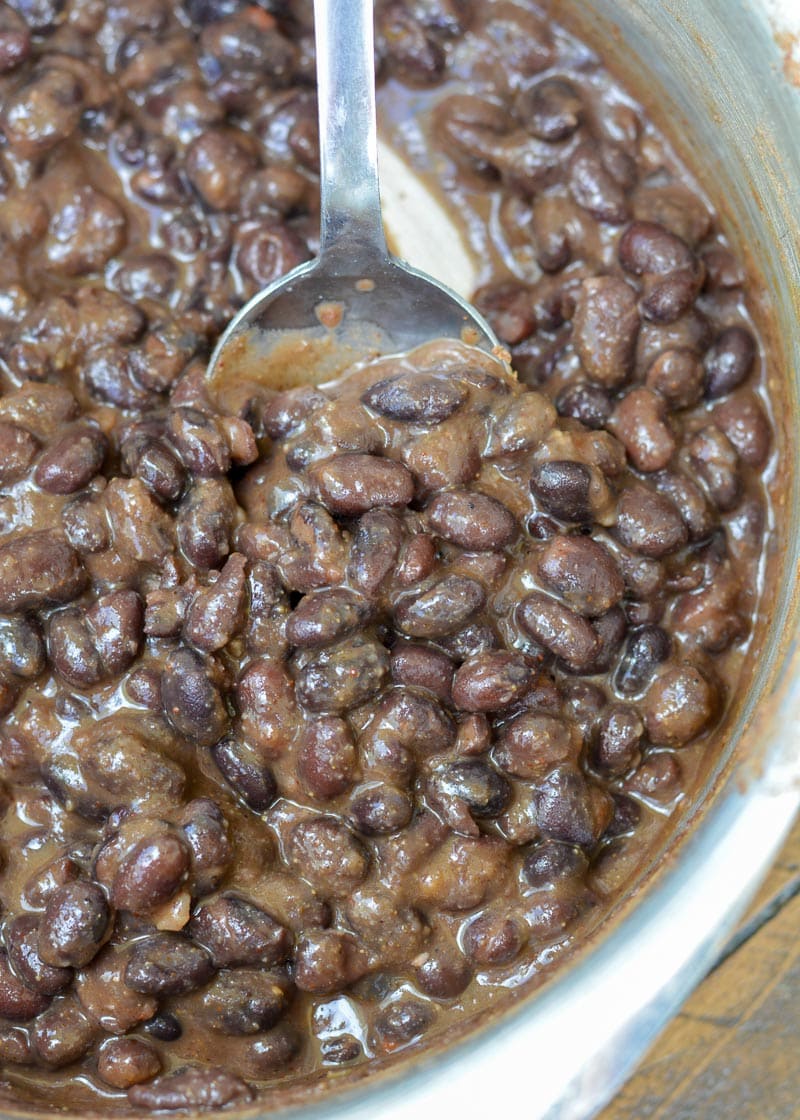 Learn how to make the best Seasoned Black Beans! This healthy, easy black bean recipe includes canned black beans simmered in spices. This recipe is great for tacos, salads, burritos and more!