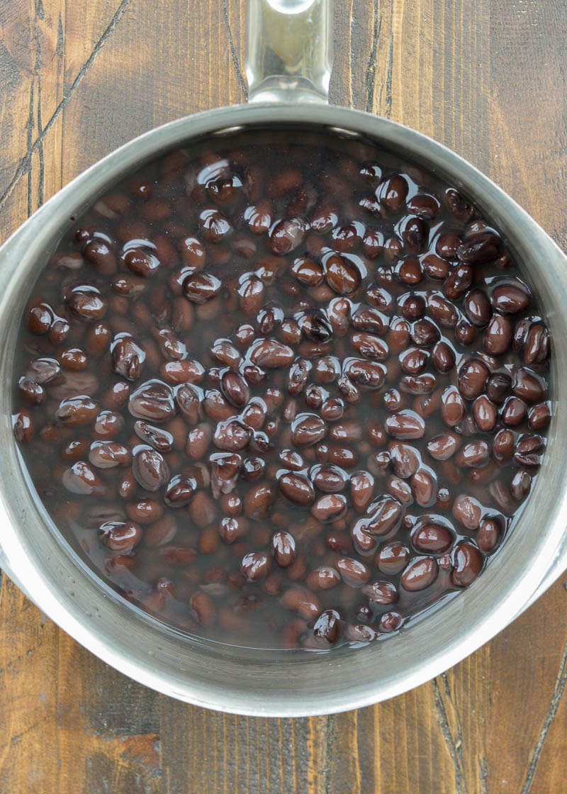 Learn how to make the best Seasoned Black Beans! This healthy, easy black bean recipe includes canned black beans simmered in spices. This recipe is great for tacos, salads, burritos and more!