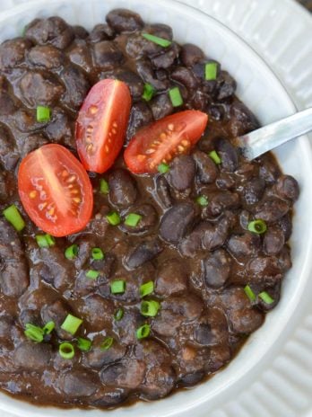 Learn how to make the best Seasoned Black Beans! This healthy, easy black bean recipe includes canned black beans simmered in spices. This recipe is great for tacos, salads, burritos and more!